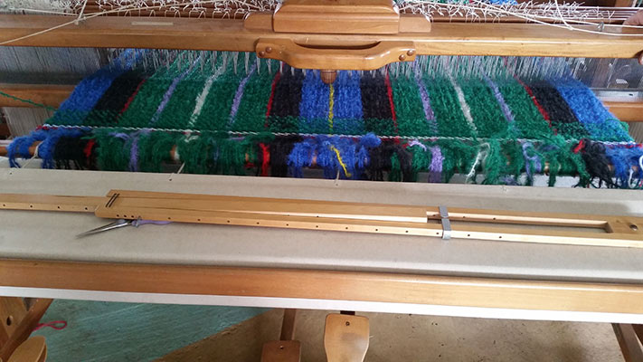 Cutting of the Tartan from the Loom